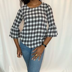 Plaid black and white polyester bell sleeve shirt. Perfect for work outfits!
